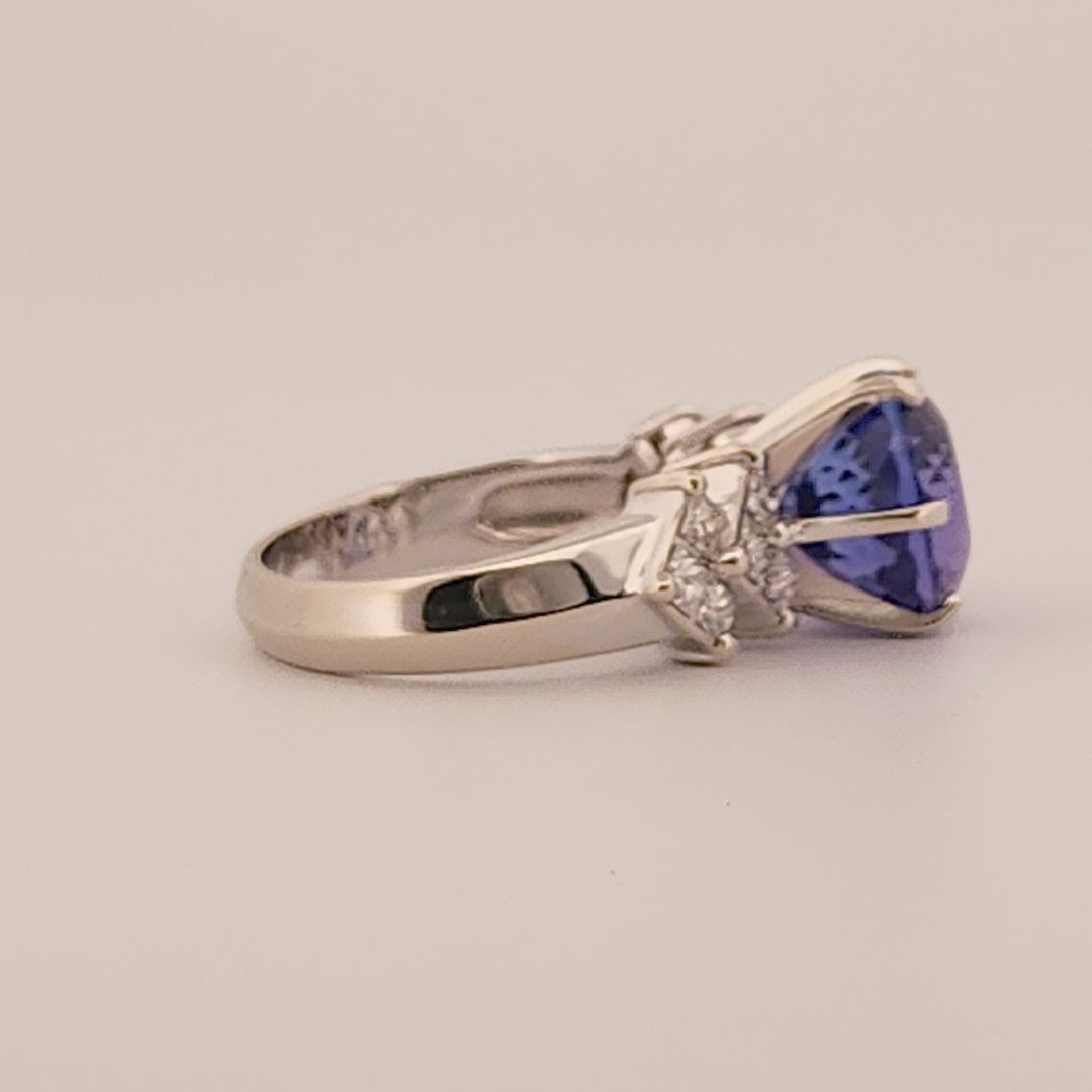 Natural Round Modified Brilliant Cut, Bluish Violet Tanzanite (5.25 CT - 10.20 mm) with 12 Natural Princess cut 3x3 mm Square Diamonds (1.92 CTW) Ring 14K White Gold. GIA Certified (2231466864).