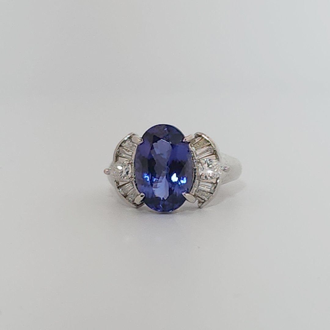 Modified Brilliant Cut, Oval Shape, Bluish Violet Tanzanite (4.38CT, 12.77 x 8.29 x 5.57 mm), Mounted at Platinum 900 Ring with Natural Diamonds (0.60 CTW, E/F-VS). GIA Certified (5232466621). Size 5.75