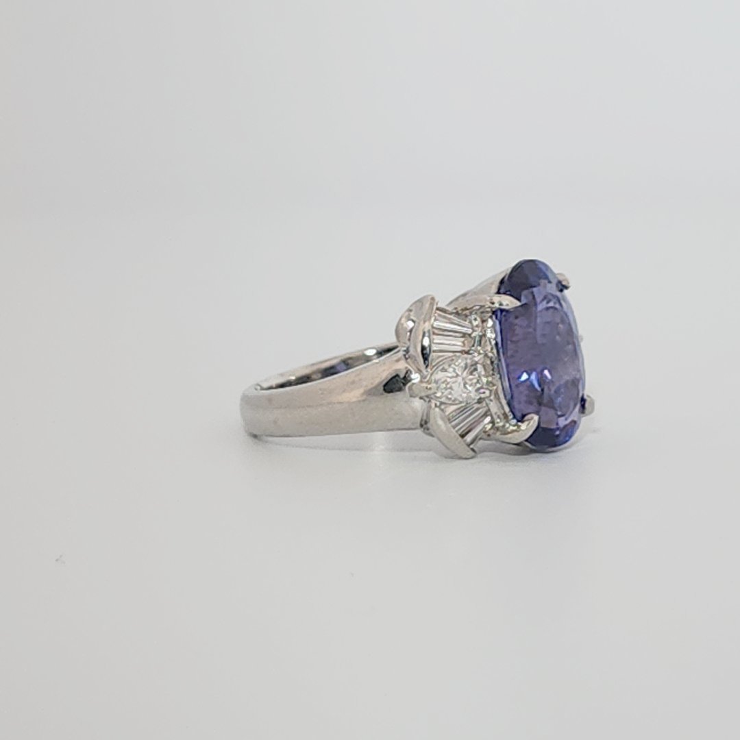 Modified Brilliant Cut, Oval Shape, Bluish Violet Tanzanite (4.38CT, 12.77 x 8.29 x 5.57 mm), Mounted at Platinum 900 Ring with Natural Diamonds (0.60 CTW, E/F-VS). GIA Certified (5232466621). Size 5.75