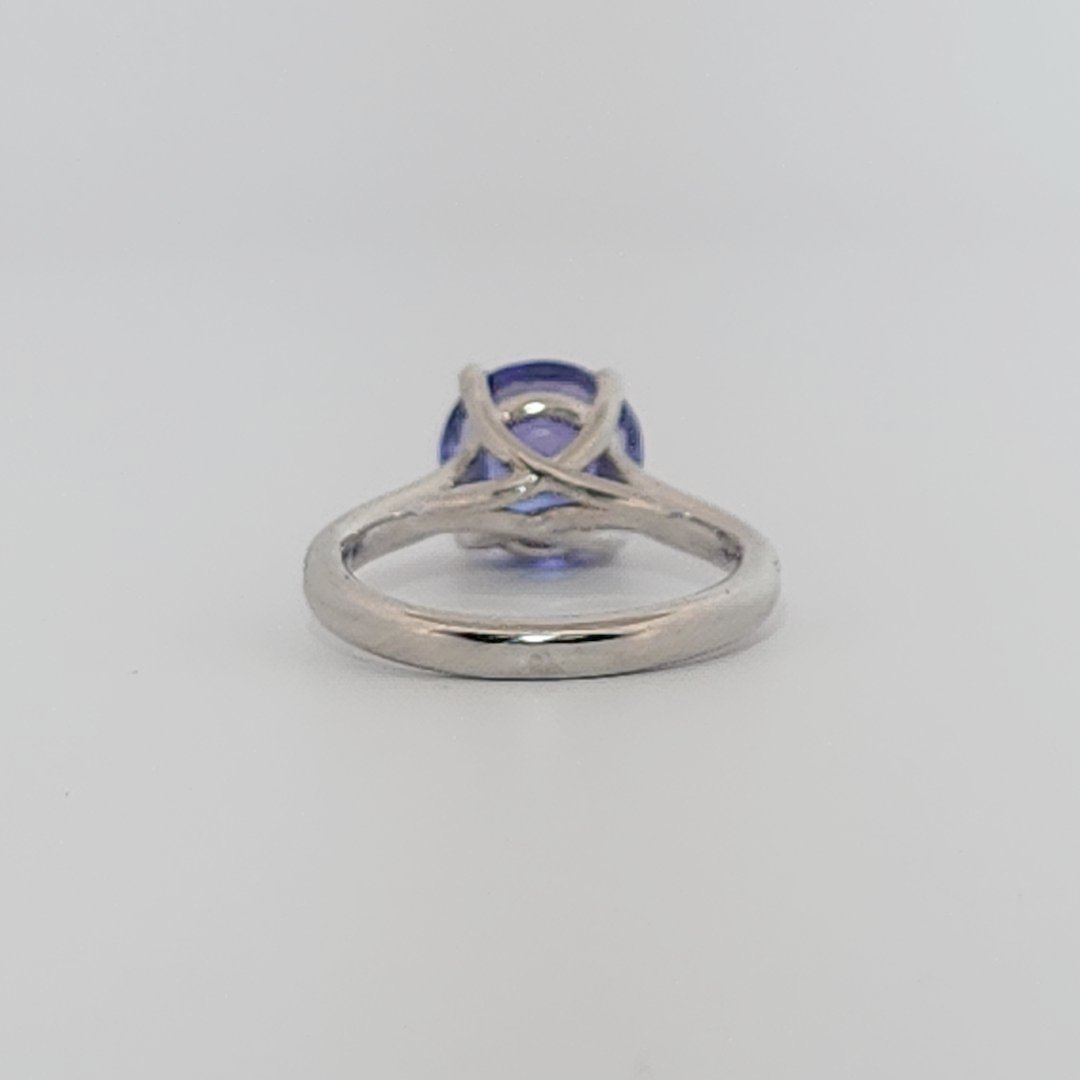 Modified Brilliant Cut, Round Shape, Bluish Violet Tanzanite (2.80CT, 8.89 - 9.01 x 5.53 mm), Mounted at Platinum 950 ring with Natural Diamonds (0.18 CTW E/F-SI). GIA Certified (5231466569). Size 5.25