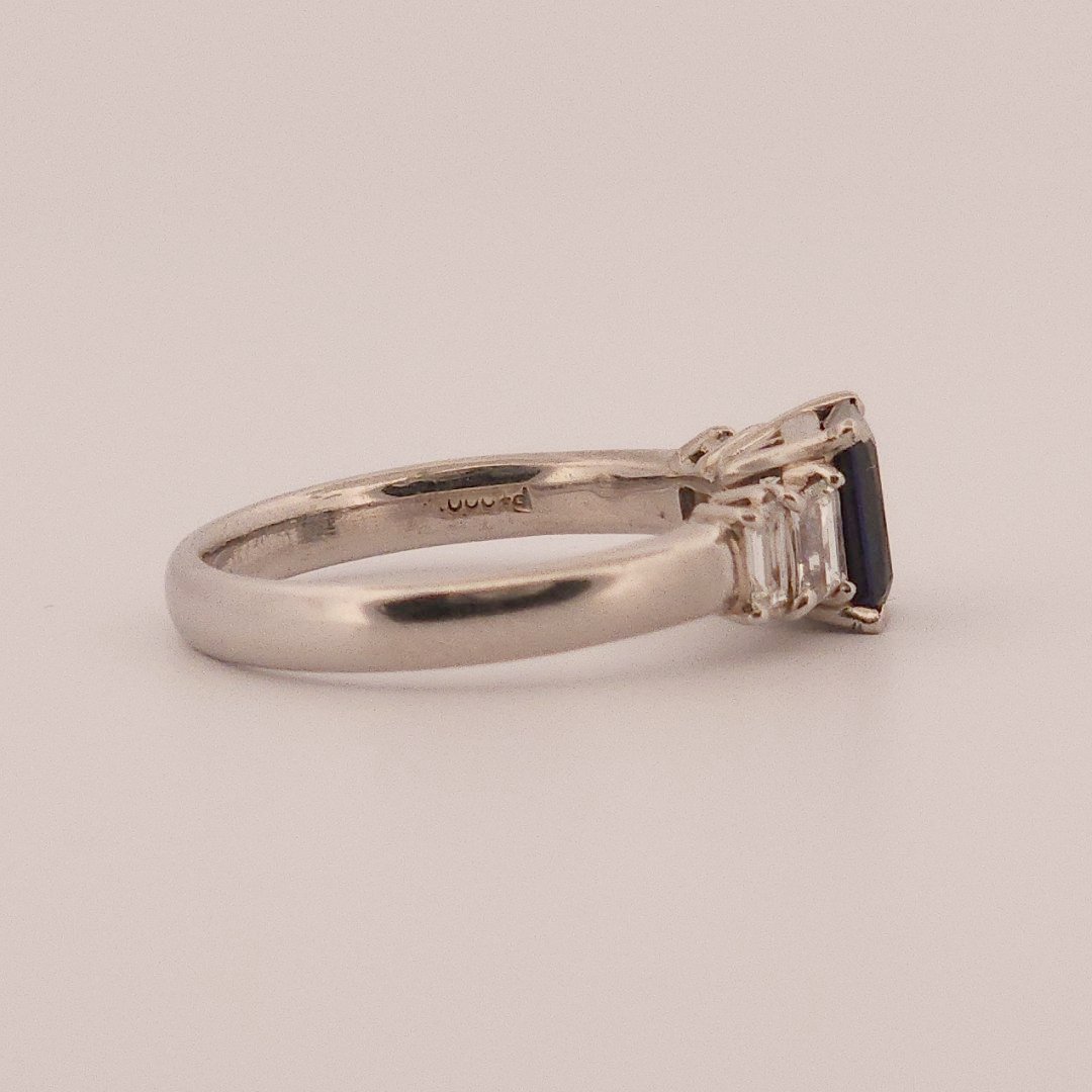 Emerald Step-Cut, AAA Natural Blue Sapphire (1.15CT, 7x5mm), Mounted on Platinum 900 Ring with Natural Diamonds (0.77 CTW, E/F VS1/VS2). Size 7.25