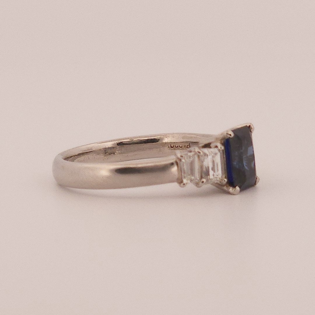 Emerald Step-Cut, AAA Natural Blue Sapphire (1.15CT, 7x5mm), Mounted on Platinum 900 Ring with Natural Diamonds (0.77 CTW, E/F VS1/VS2). Size 7.25