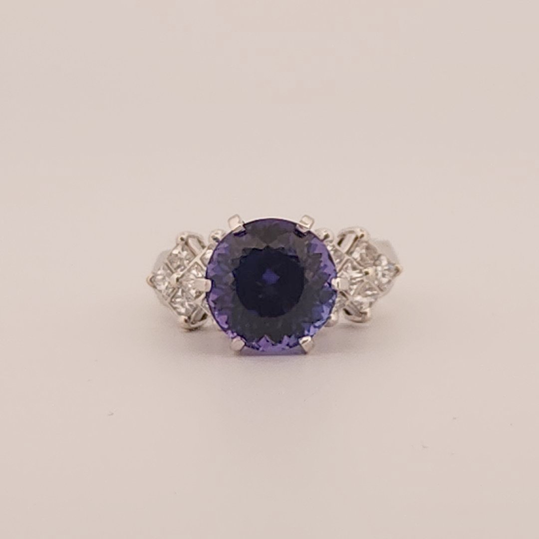 Natural Round Modified Brilliant Cut, Bluish Violet Tanzanite (5.25 CT - 10.20 mm) with 12 Natural Princess cut 3x3 mm Square Diamonds (1.92 CTW) Ring 14K White Gold. GIA Certified (2231466864).